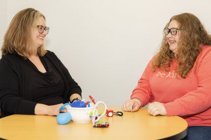 Emily Hinton and Mckenna Cole sitting at a table