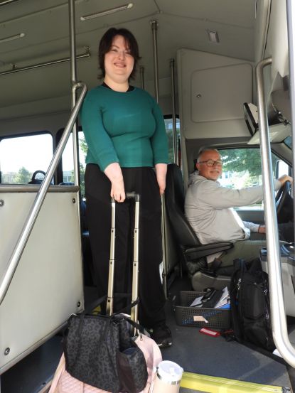 Waubonsee student Krystal Donnelley is welcomed aboard the free campus shuttle by driver Paul Pokryfke.