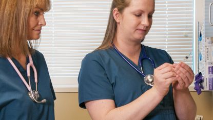 Nursing students working in the lab