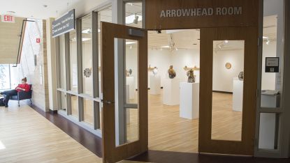 The door is open to Waubonsee's art exhibition space, the Arrowhead Room. 