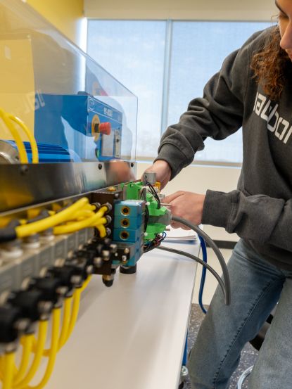 Industrial Maintenance Student working on simulator
