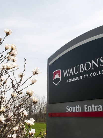 Waubonsee South Entrance sign spring flowers