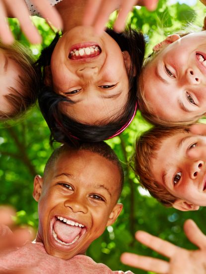 Group of kids in circle waving