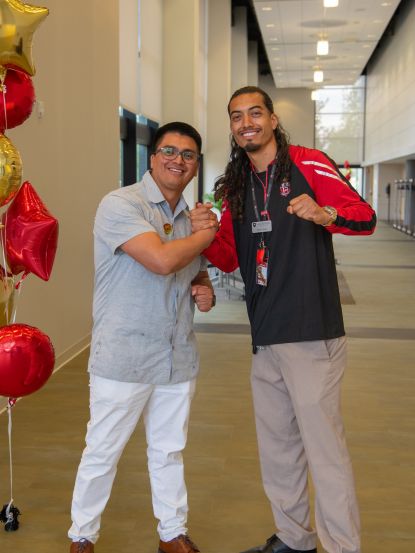 Franklin Ortega-Palaguachi and guest speaker posing together