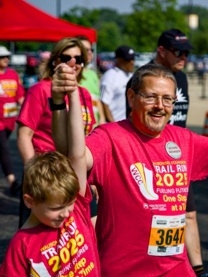 one adult two children, from the community participating in Waubonsee Foundation Annual Trail Race Fundraiser