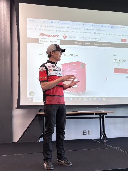 NHRA Professional Racer and team owner Steve Johnson visited with Waubonsee Community College automotive students and presented five students with the "Be a Technician" (Bat-man) national scholarship.