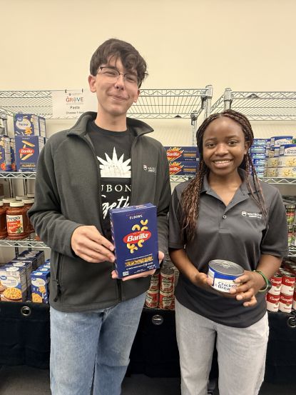 Waubonsee student workers John Metych (Left) and Germaine Mwizera (Right) stock the shelves ahead of the fall semester.