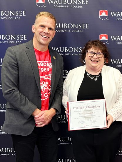 Waubonsee President Dr. Brian Knetl and Board of Trustee Patrick Kelsey present the 2026 Dr. Christine J. Sobek Outstanding Administrator Award to Dr. Stacey Randall, Executive Director of Institutional Effectiveness, Innovation, and Planning, at the August board of trustees meeting. 