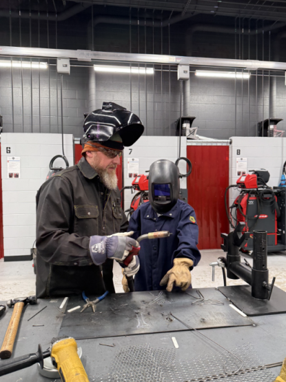 Welding Class teacher and student