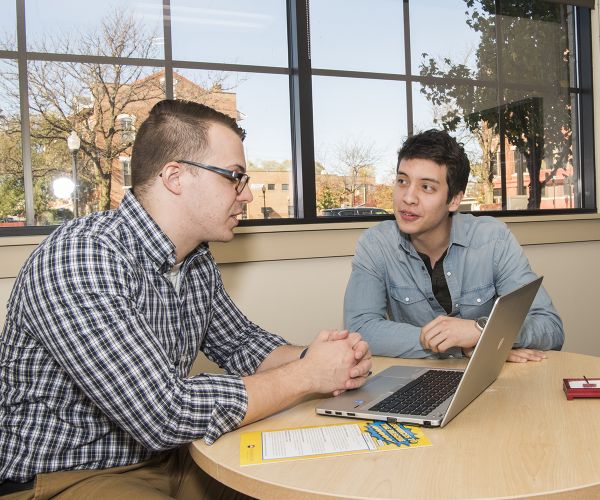 teacher giving advice to a student