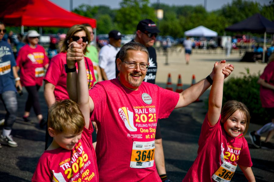 one adult two children, from the community participating in Waubonsee Foundation Annual Trail Race Fundraiser
