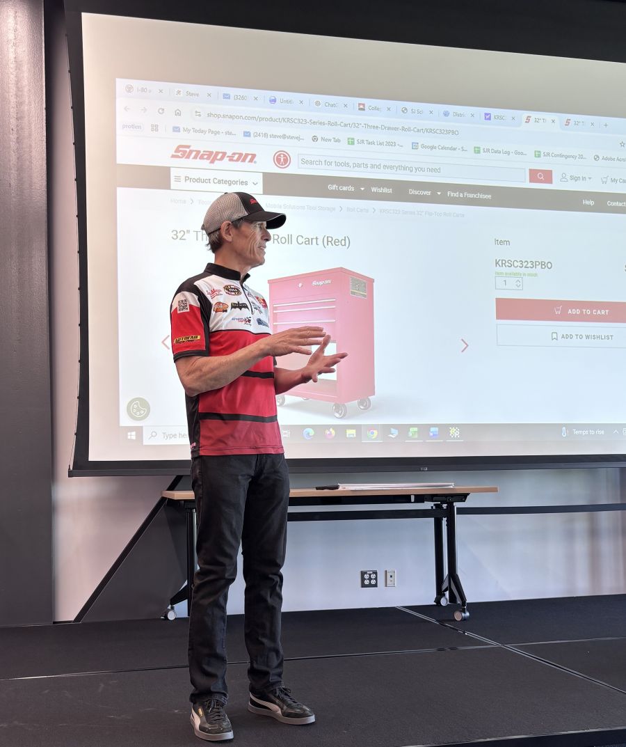 NHRA Professional Racer and team owner Steve Johnson visited with Waubonsee Community College automotive students and presented five students with the "Be a Technician" (Bat-man) national scholarship.