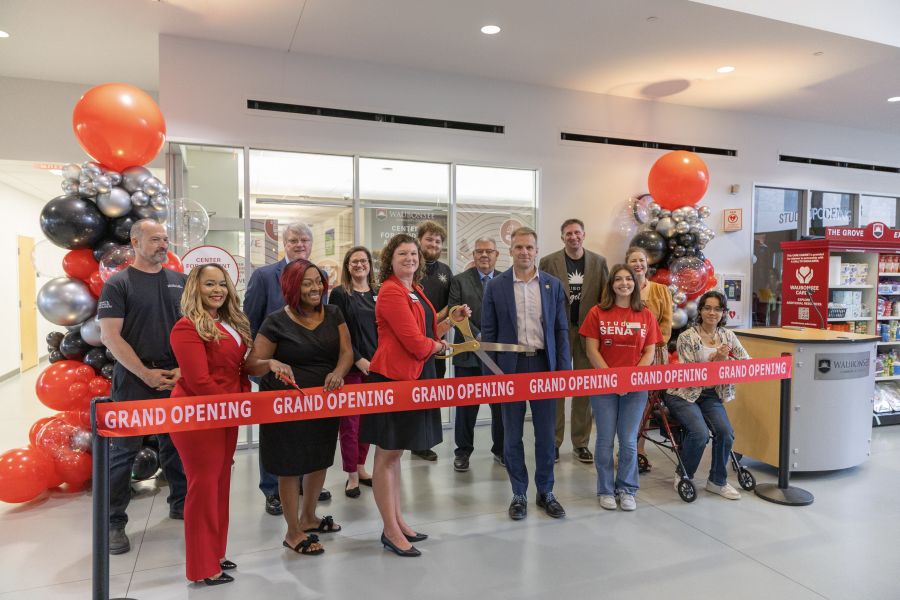 Waubonsee students, staff, and community partners cut a "Grand Opening" ribbon in front of The G.R.O.V.E. in the student center on 9-9-26