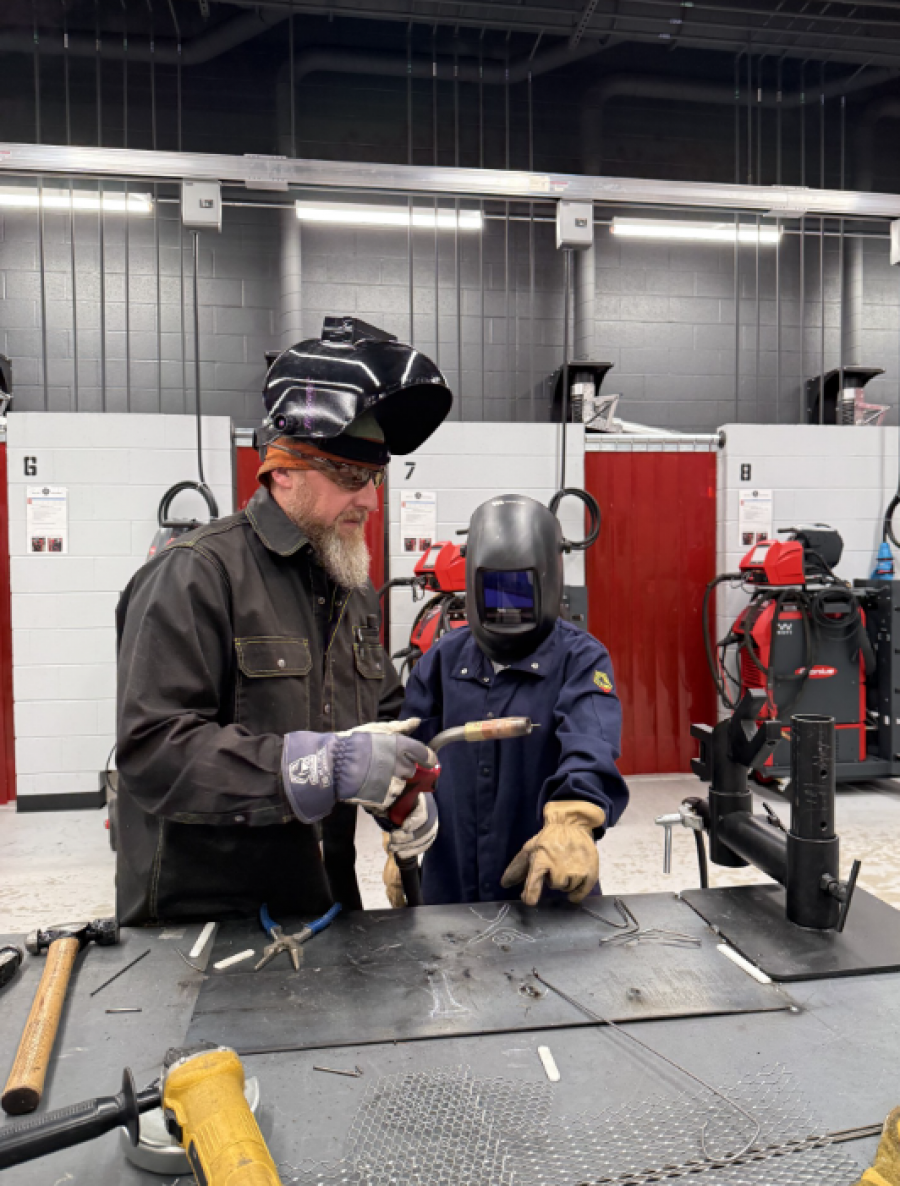 Welding Class teacher and student